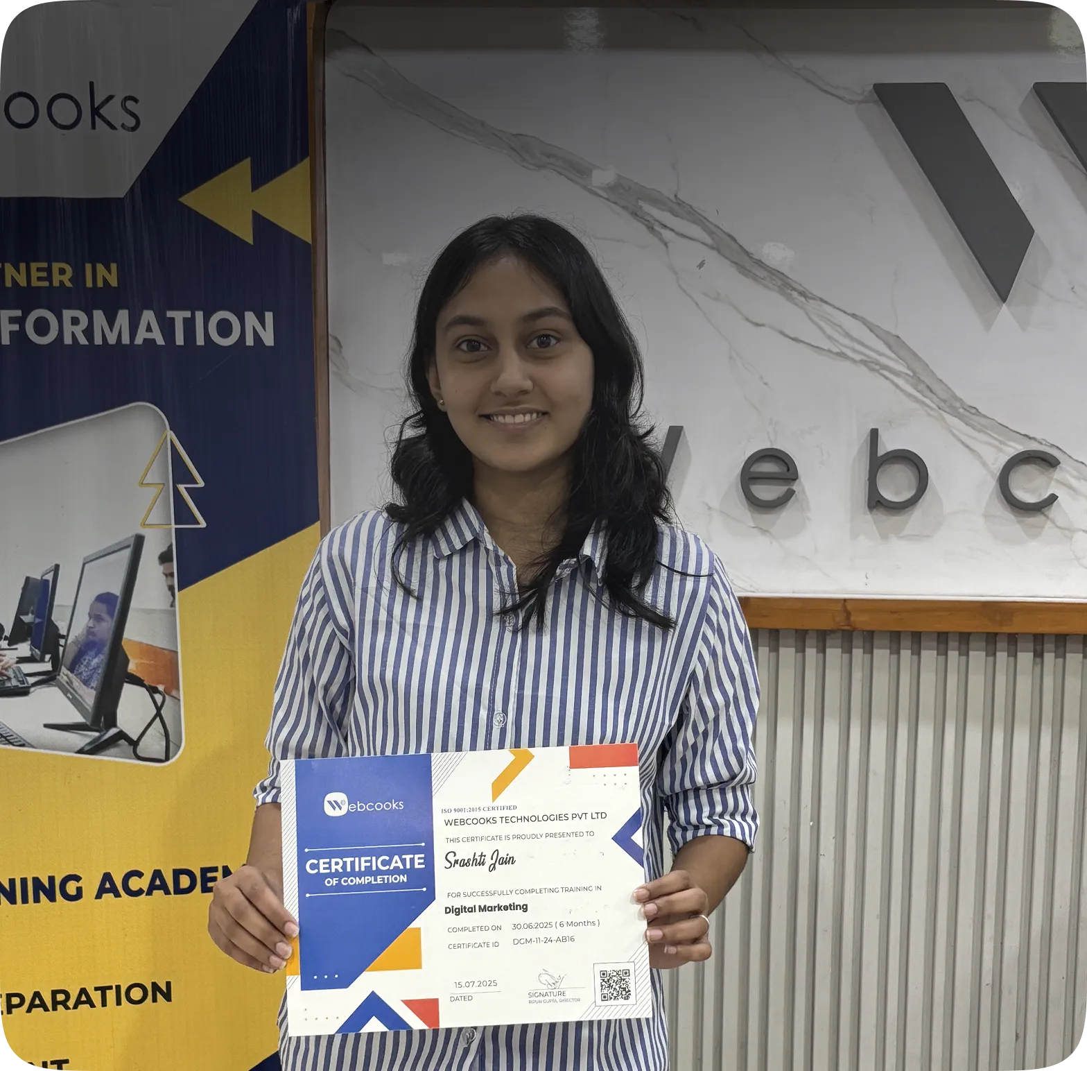 Student holding a certificate of completion